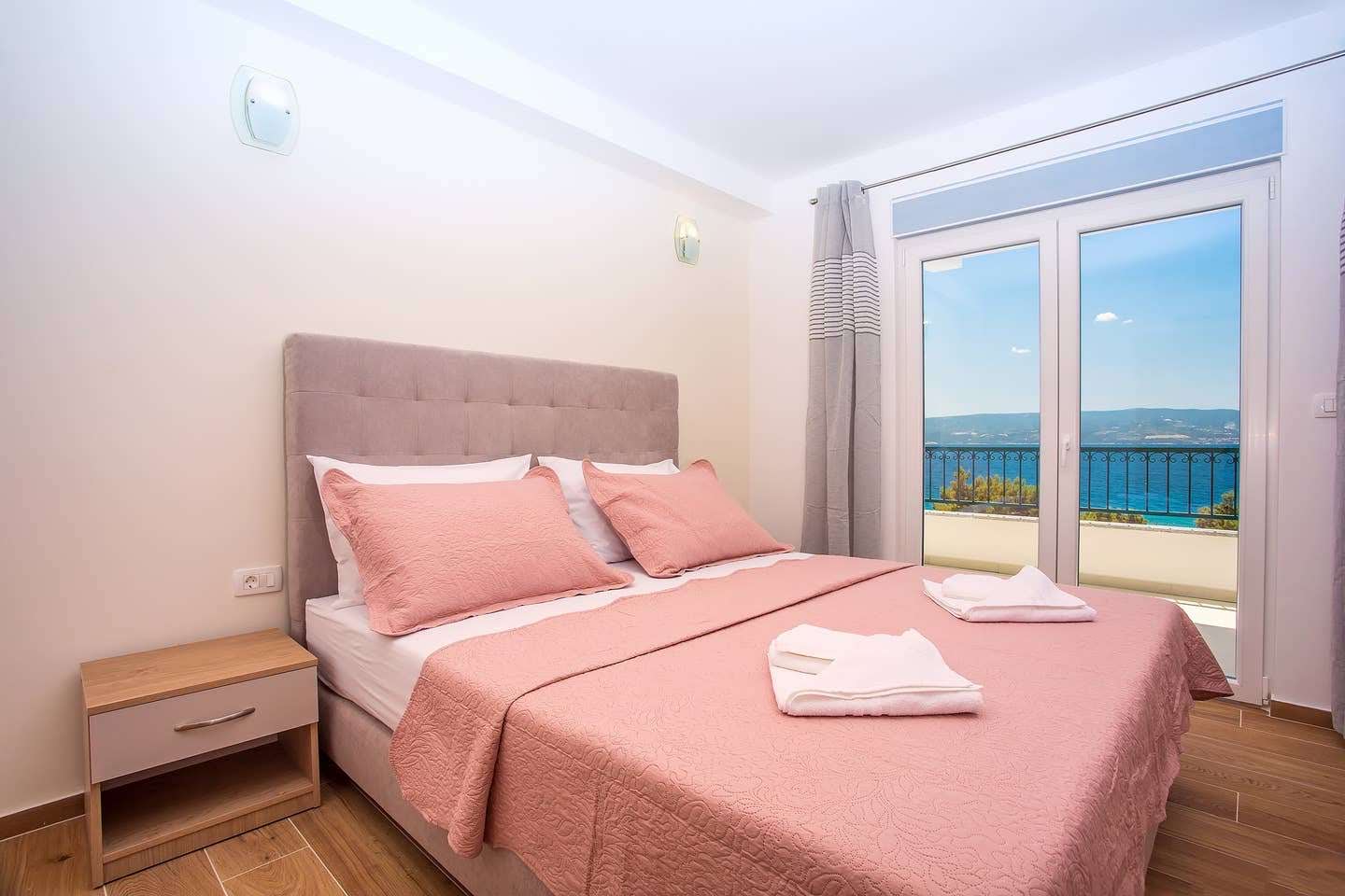 Bedroom with wardrobe and garden-view window